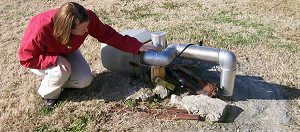 A Wayne County employee inspects a local well.