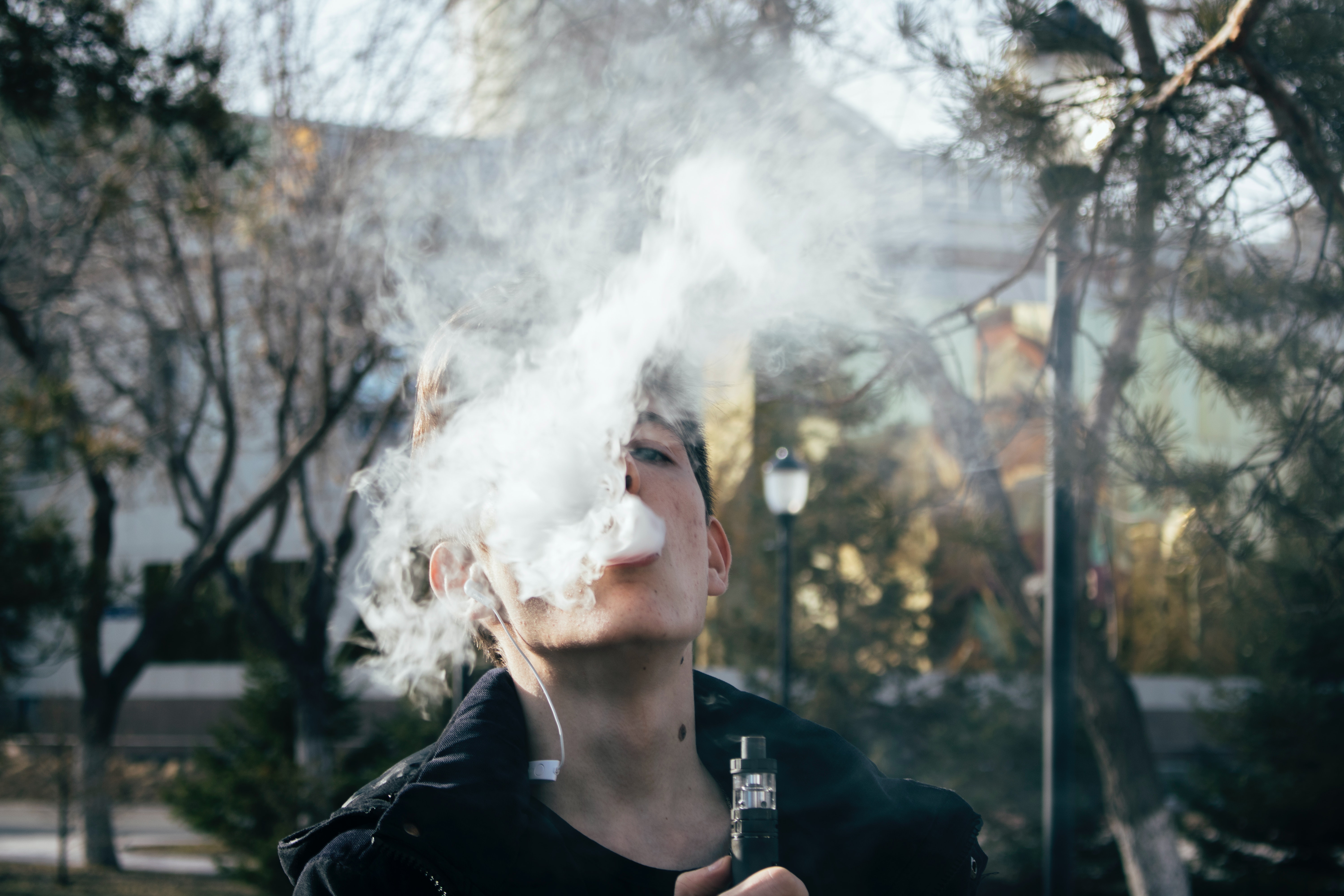 Photograph of a Man Using Vape