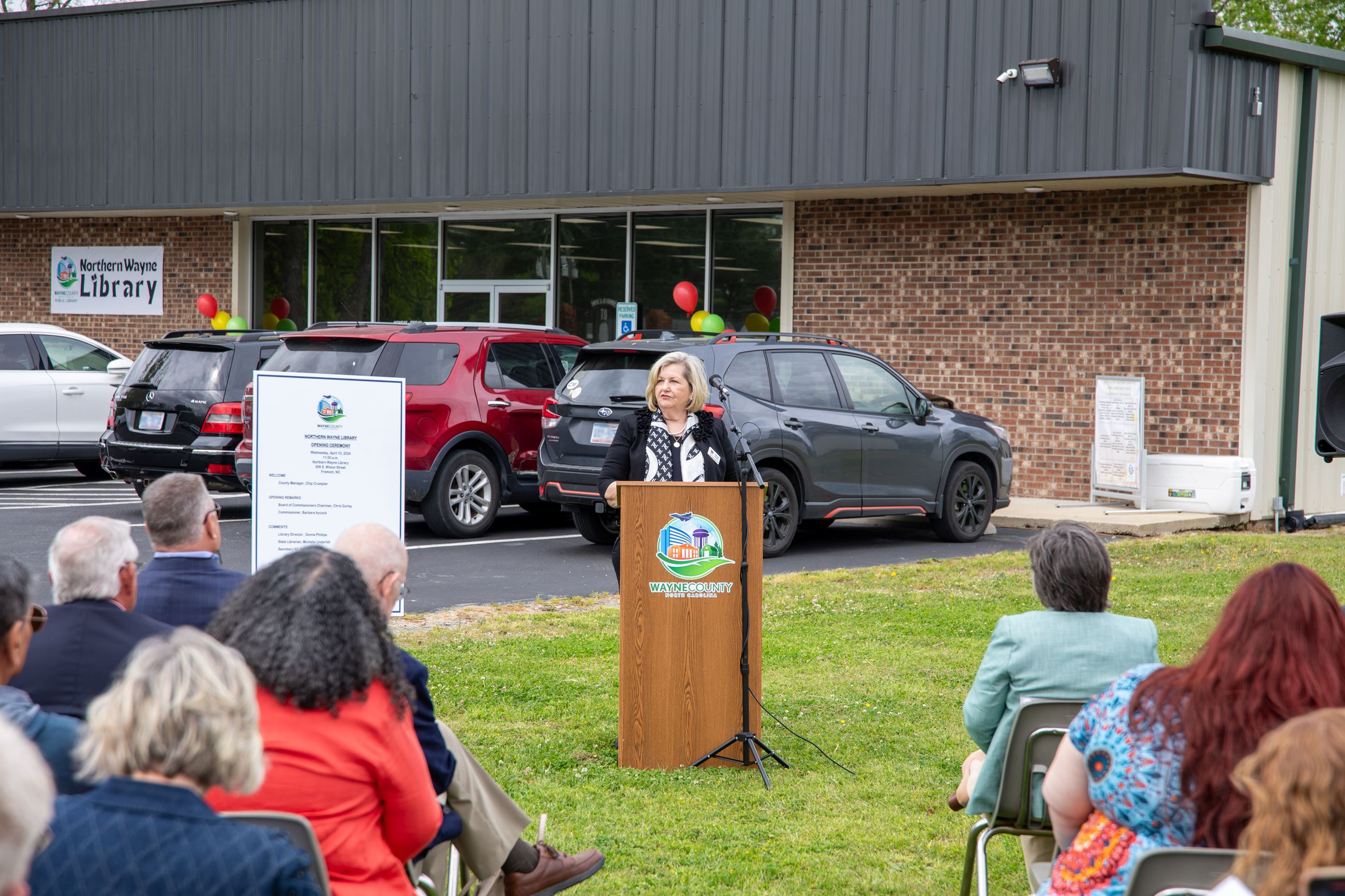 Commissioner Barbara Aycock speaking at podium