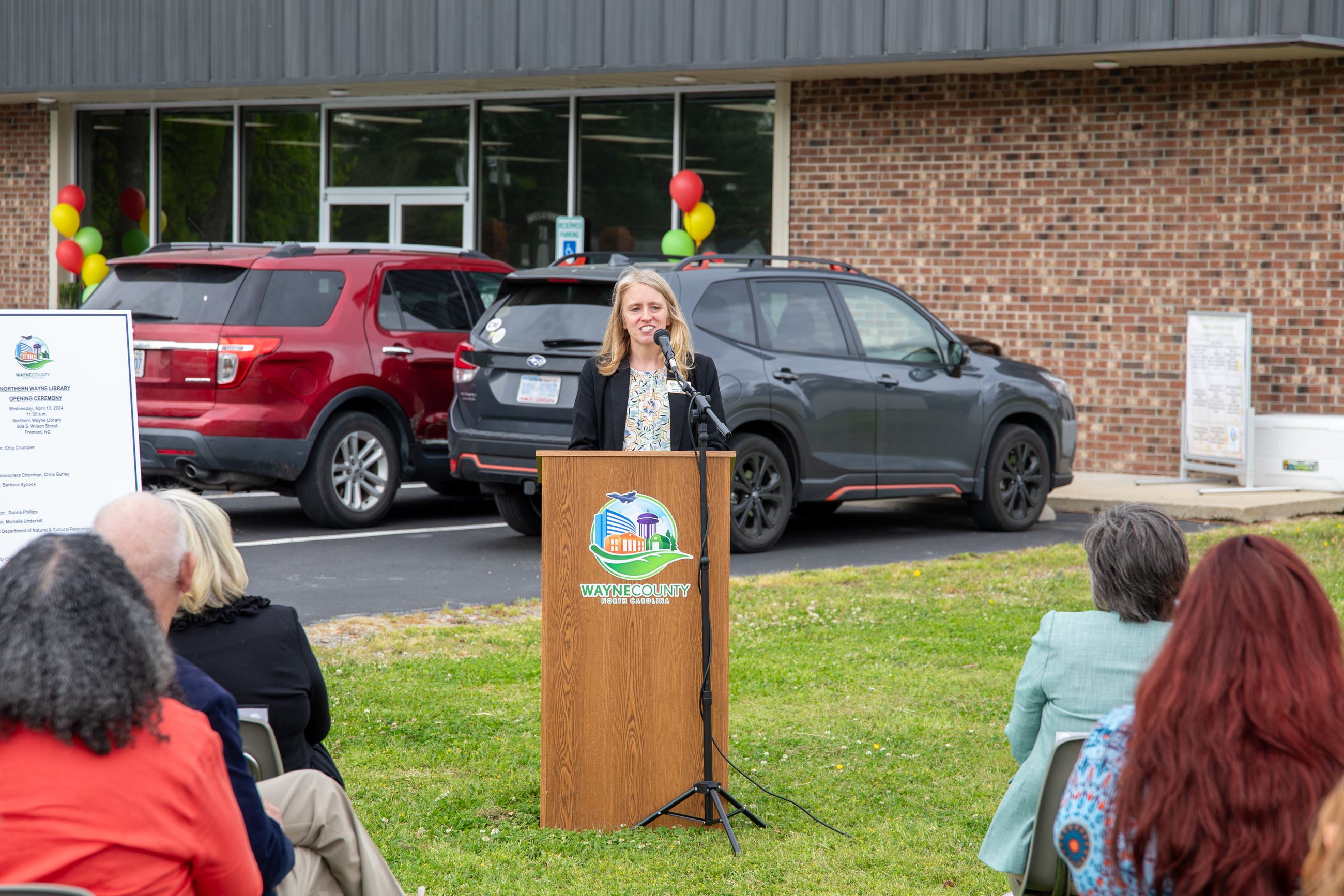 Library Assistant Director Maegen Wilson speaking at podium